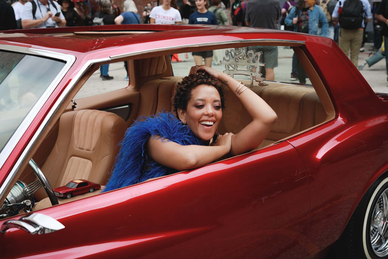 black-woman-smiling-red-car-6