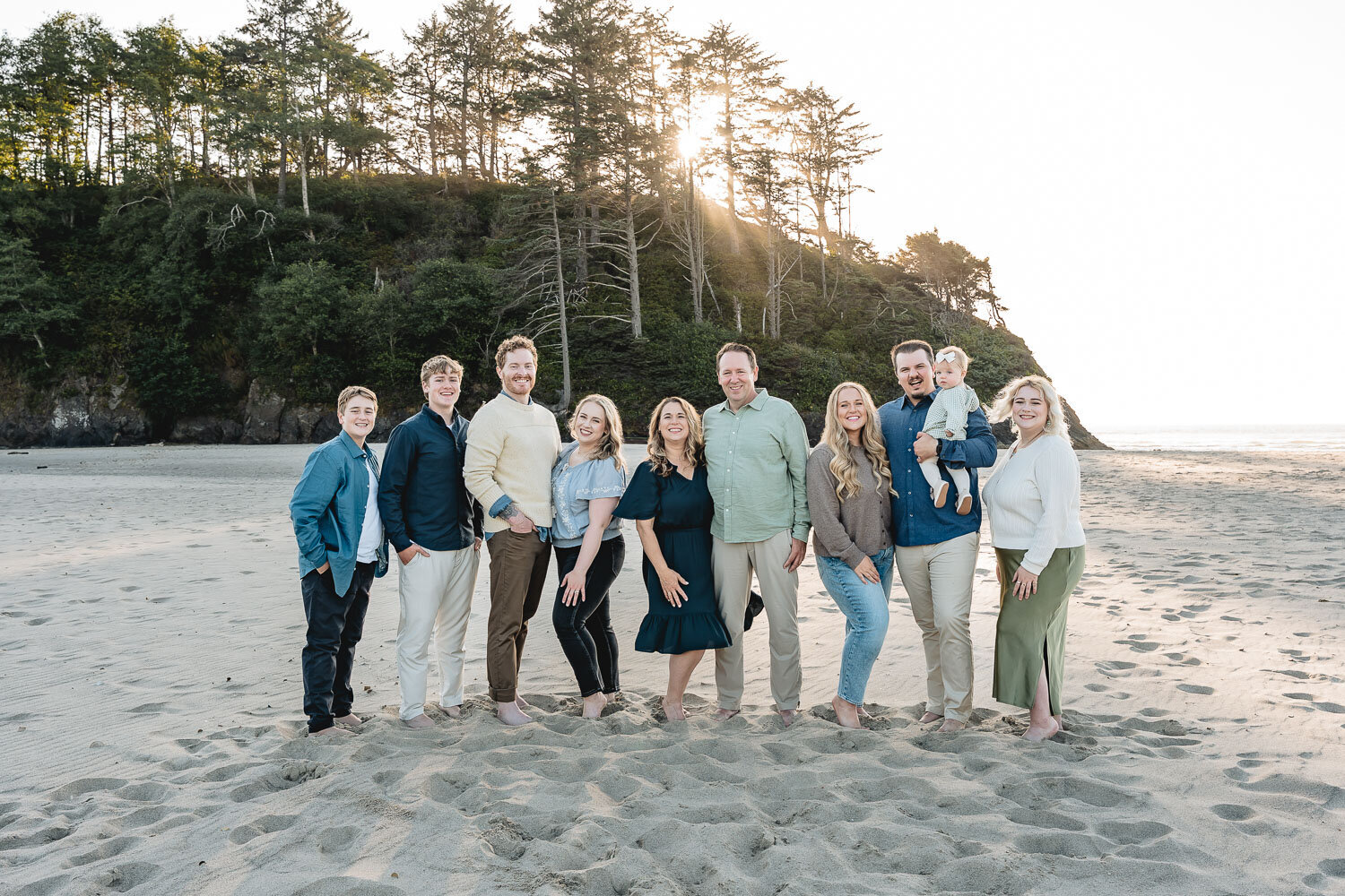 Family poses at proposal rock in Neskowin Oregon 