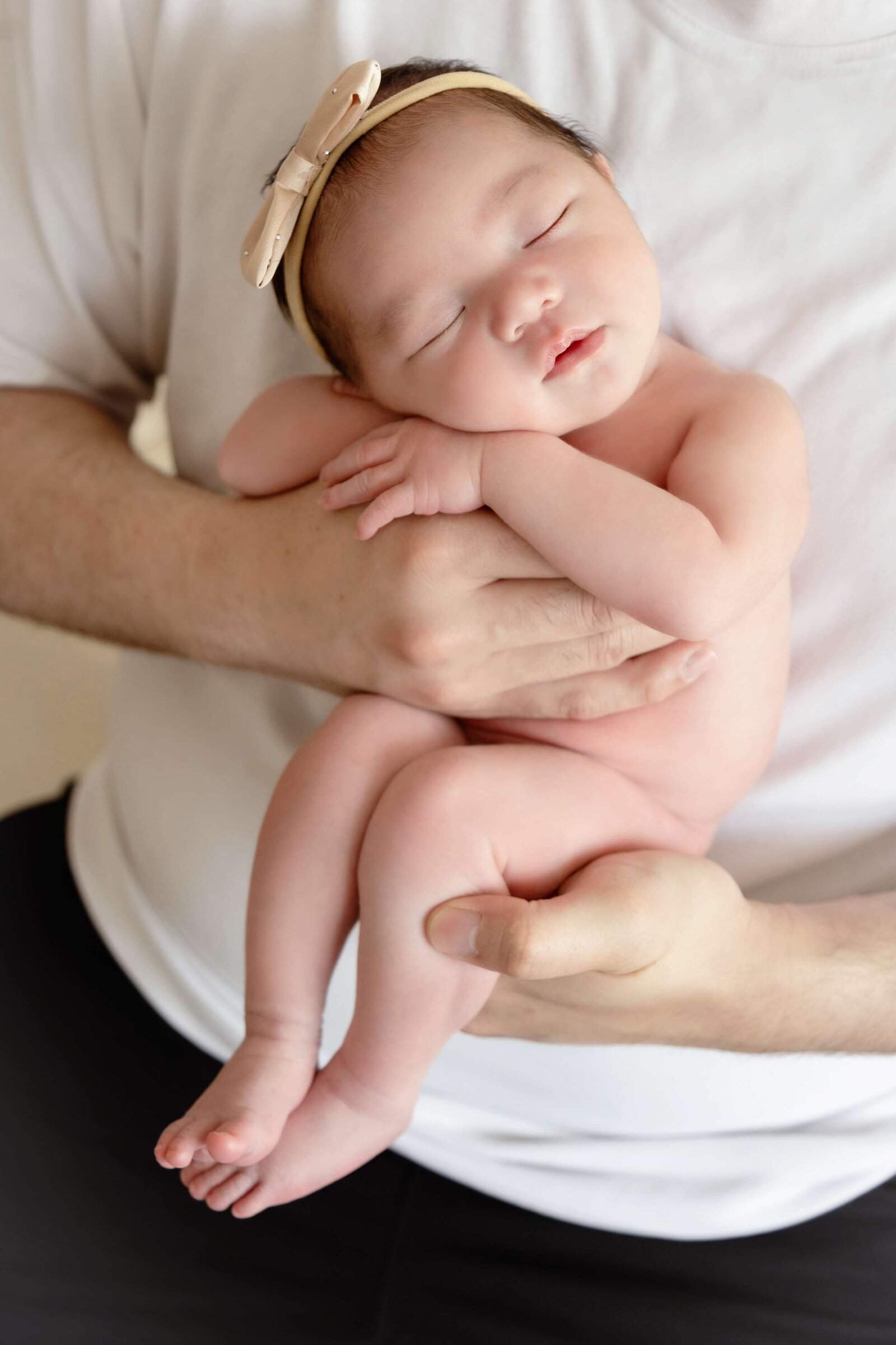 delatorrephotography baby in hands