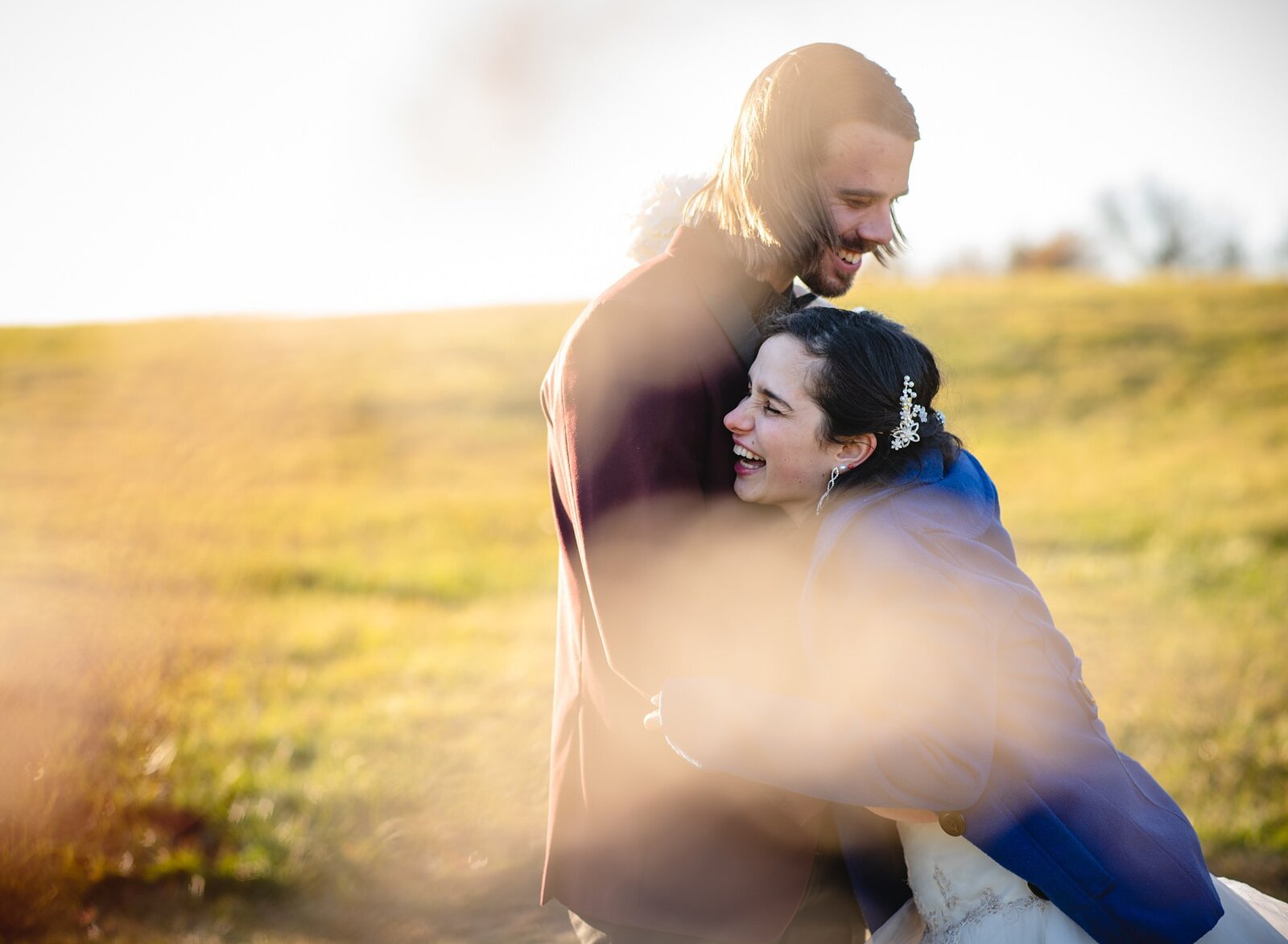 New England elopement couple laughing and hugging