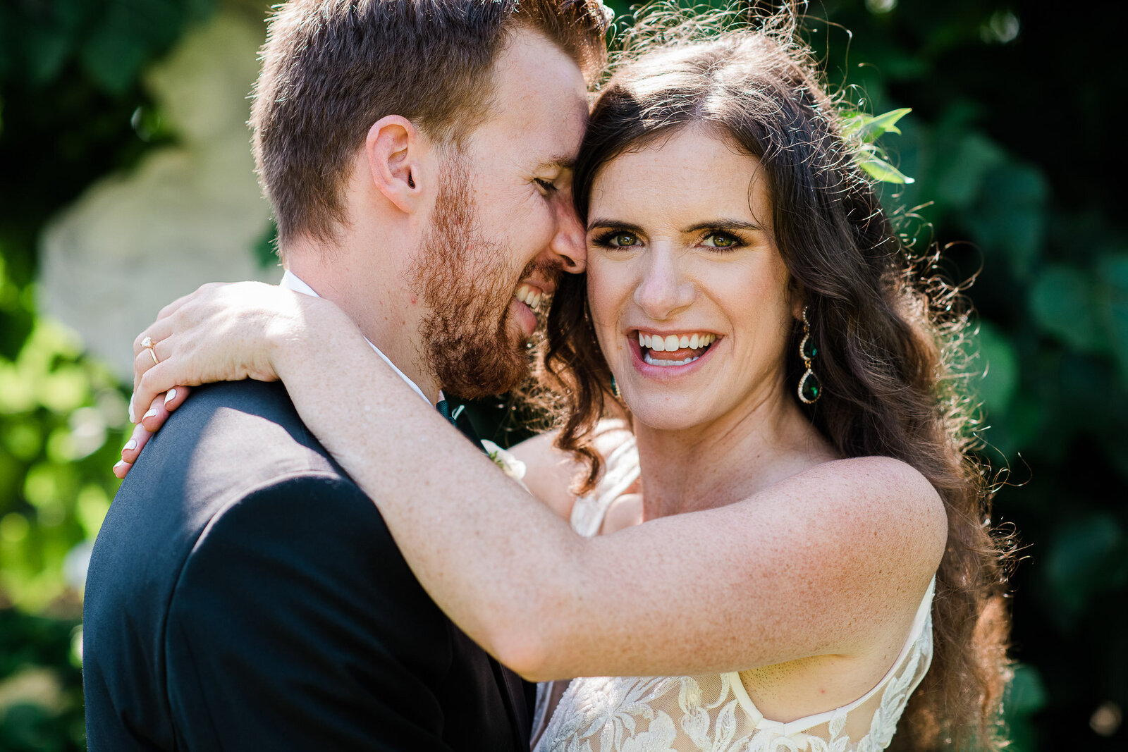 groom nuzzle bride on temple