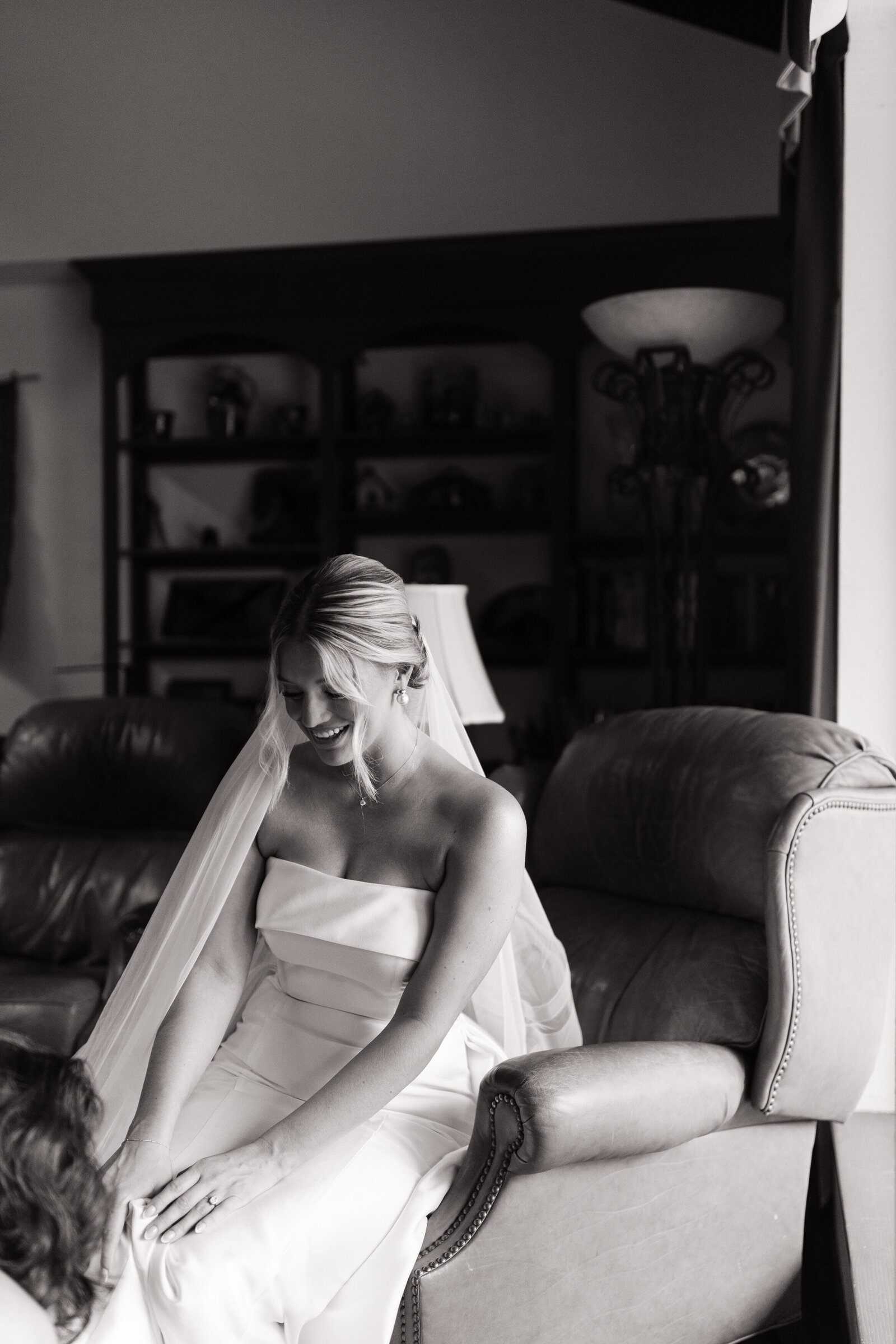 Bride putting on shoes by elopement photographer Washington State, Erica Rochelle Photography