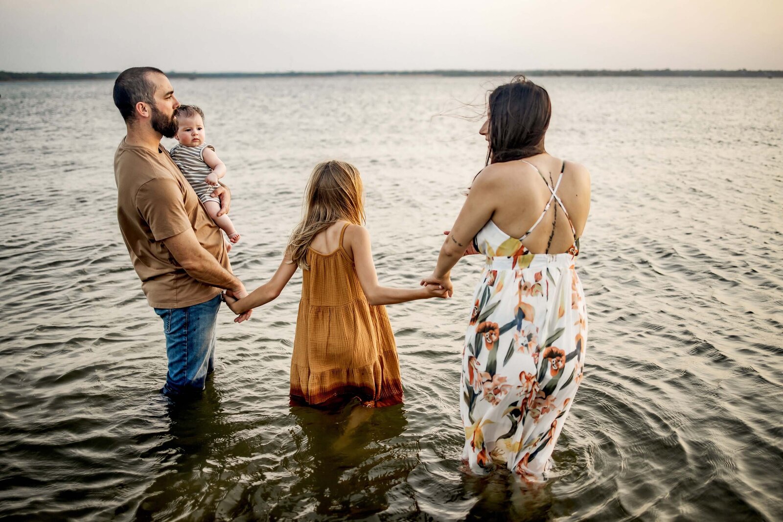 family standing in the lake in Grapevine Texas