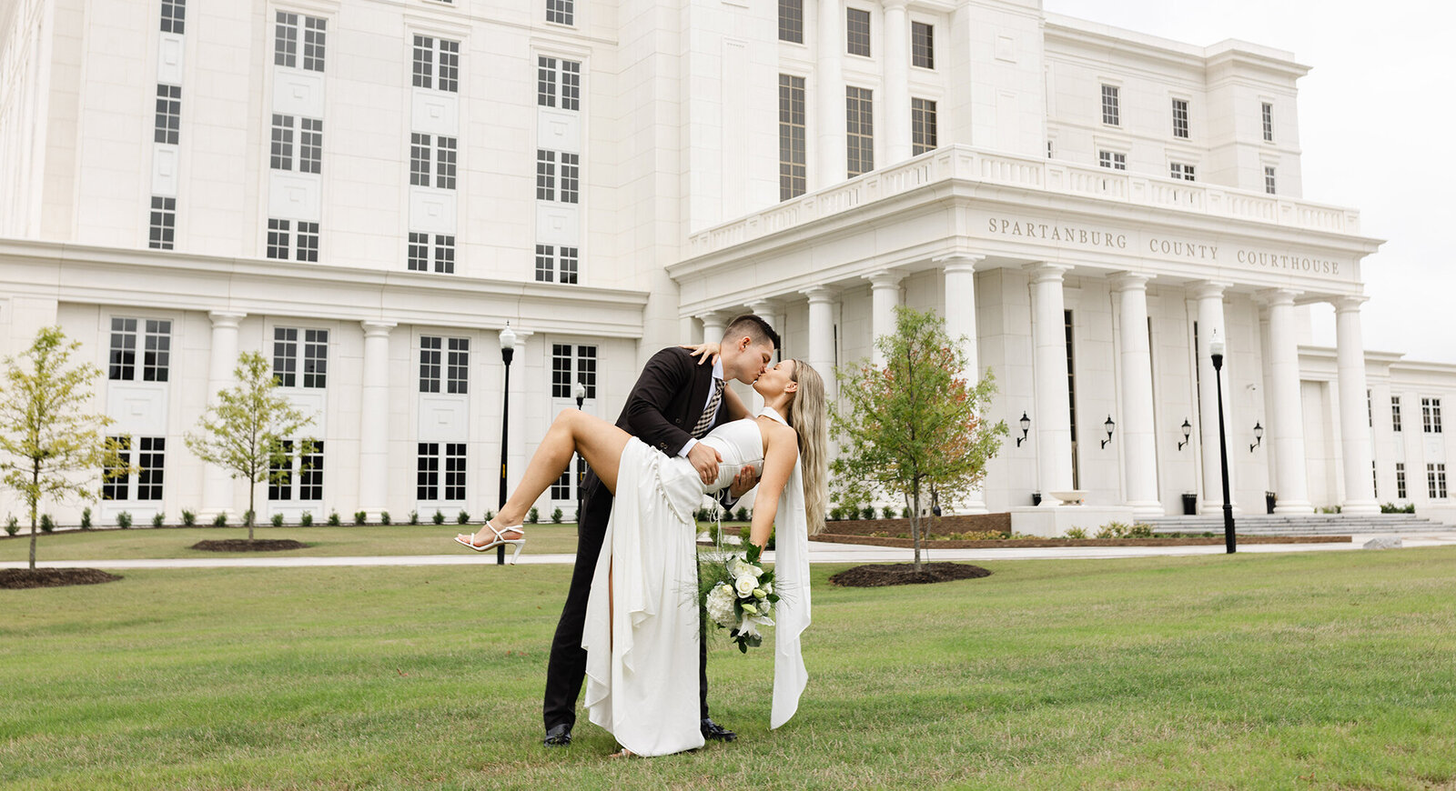 spartanburg-courthouse-wedding-photography-groom-dipping-bride.jpg copy