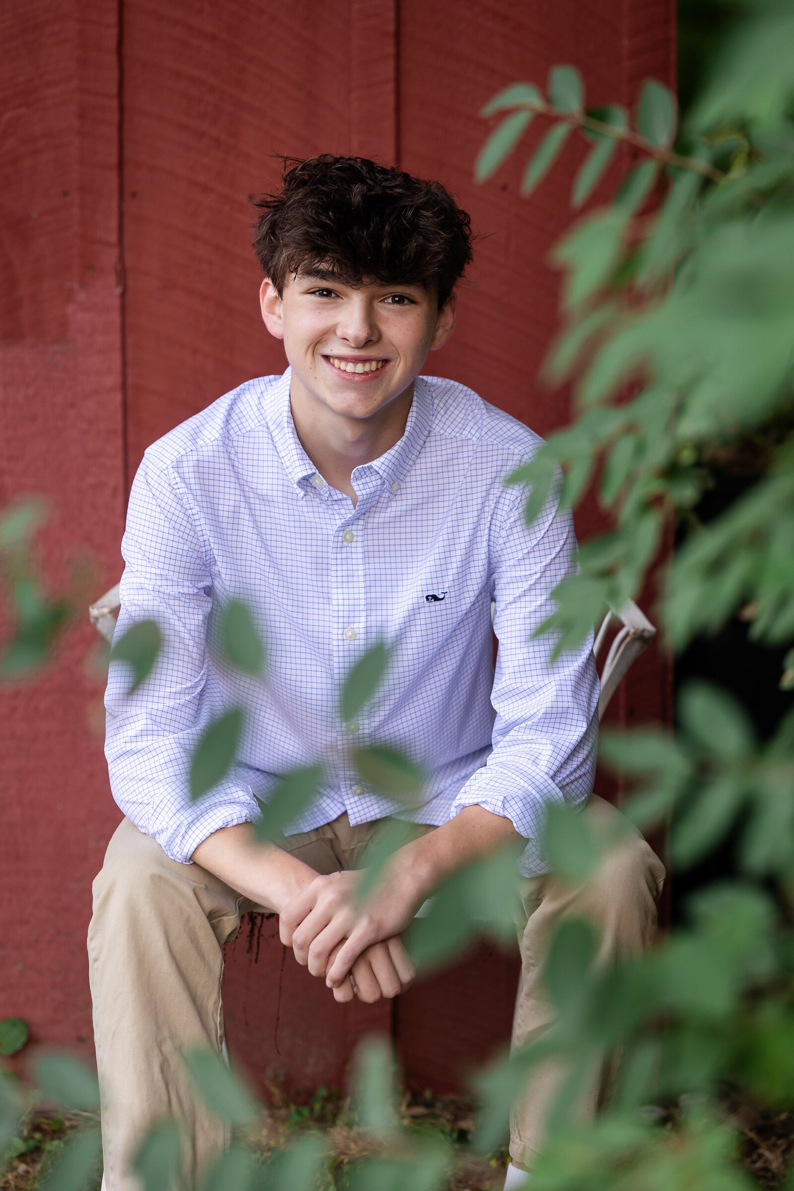 senior-guy-in-front-of-red-wall-list-gilbert-photography