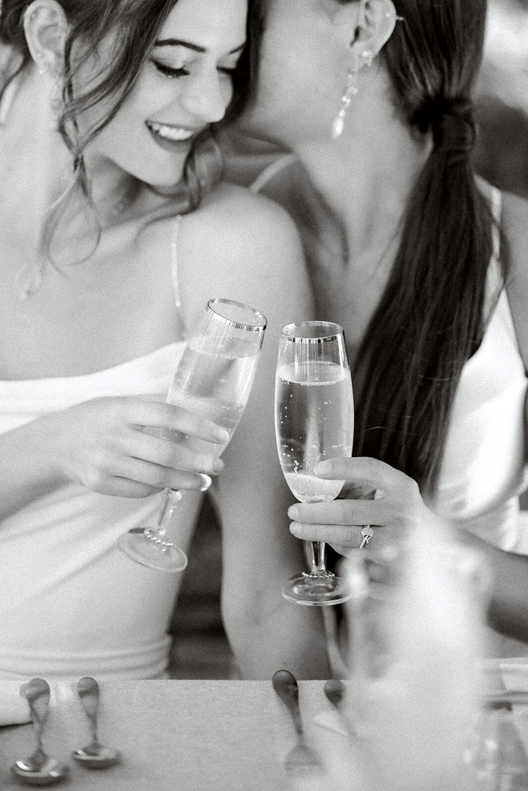 LGBTQ brides cheers on their wedding day at San Francisco City Hall in San Francisco, CA