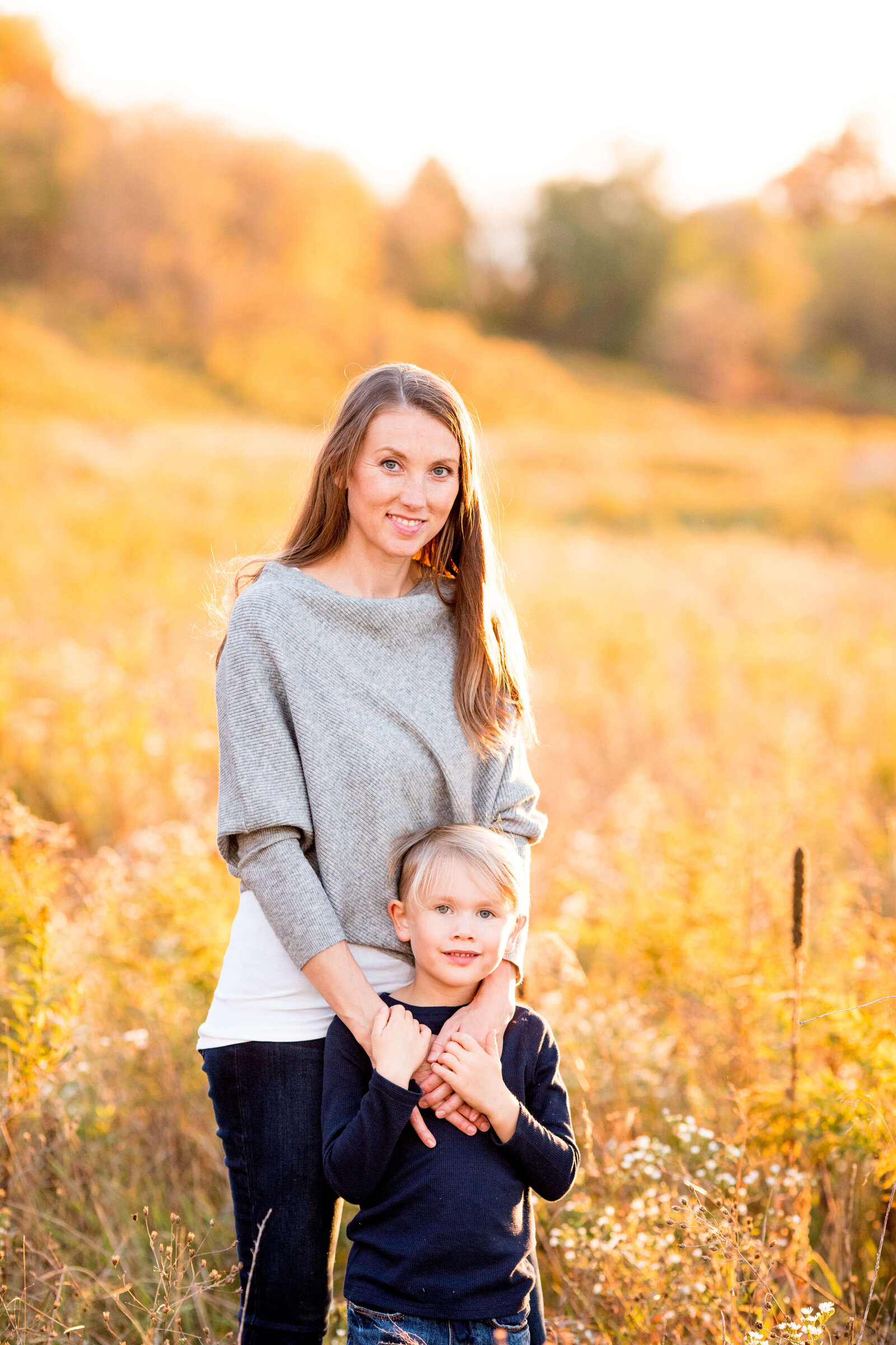 Mother poses with her eldest son along conservation trail