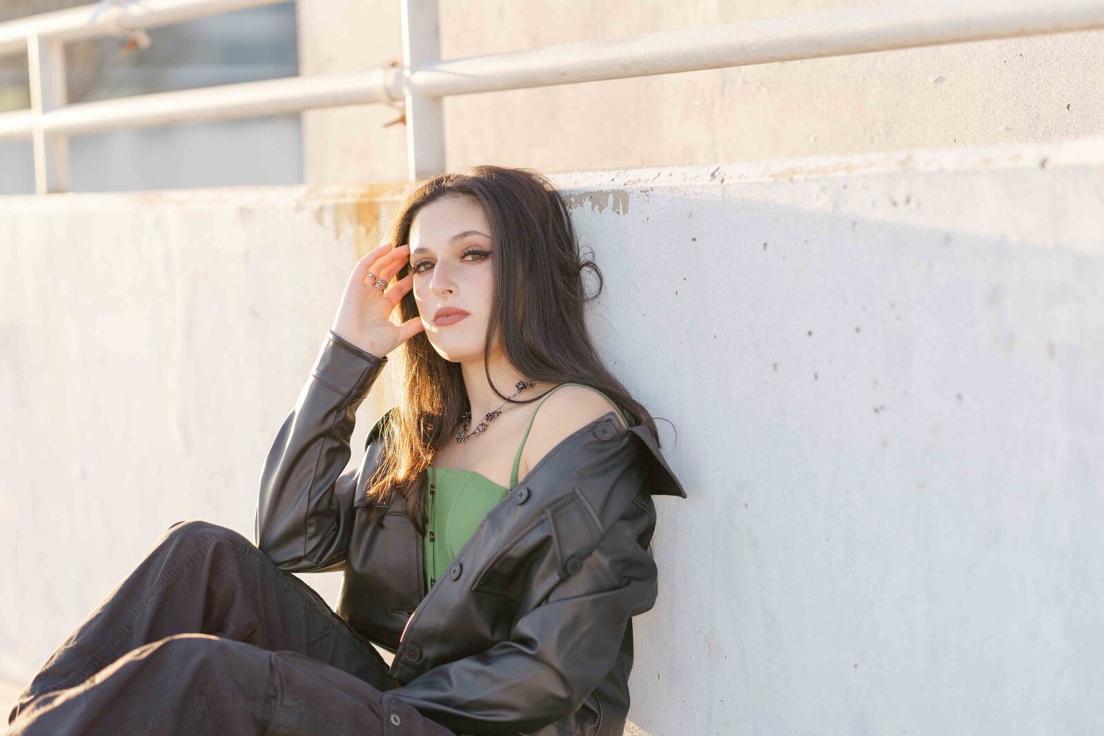 close up of a high school girl in a parking garage during senior photo in Reston, Virginia