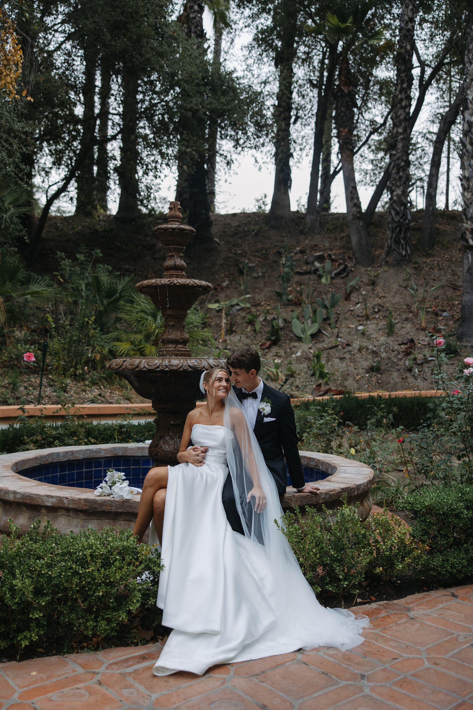 rancho las lomas wedding, bride and groom on a foutntain