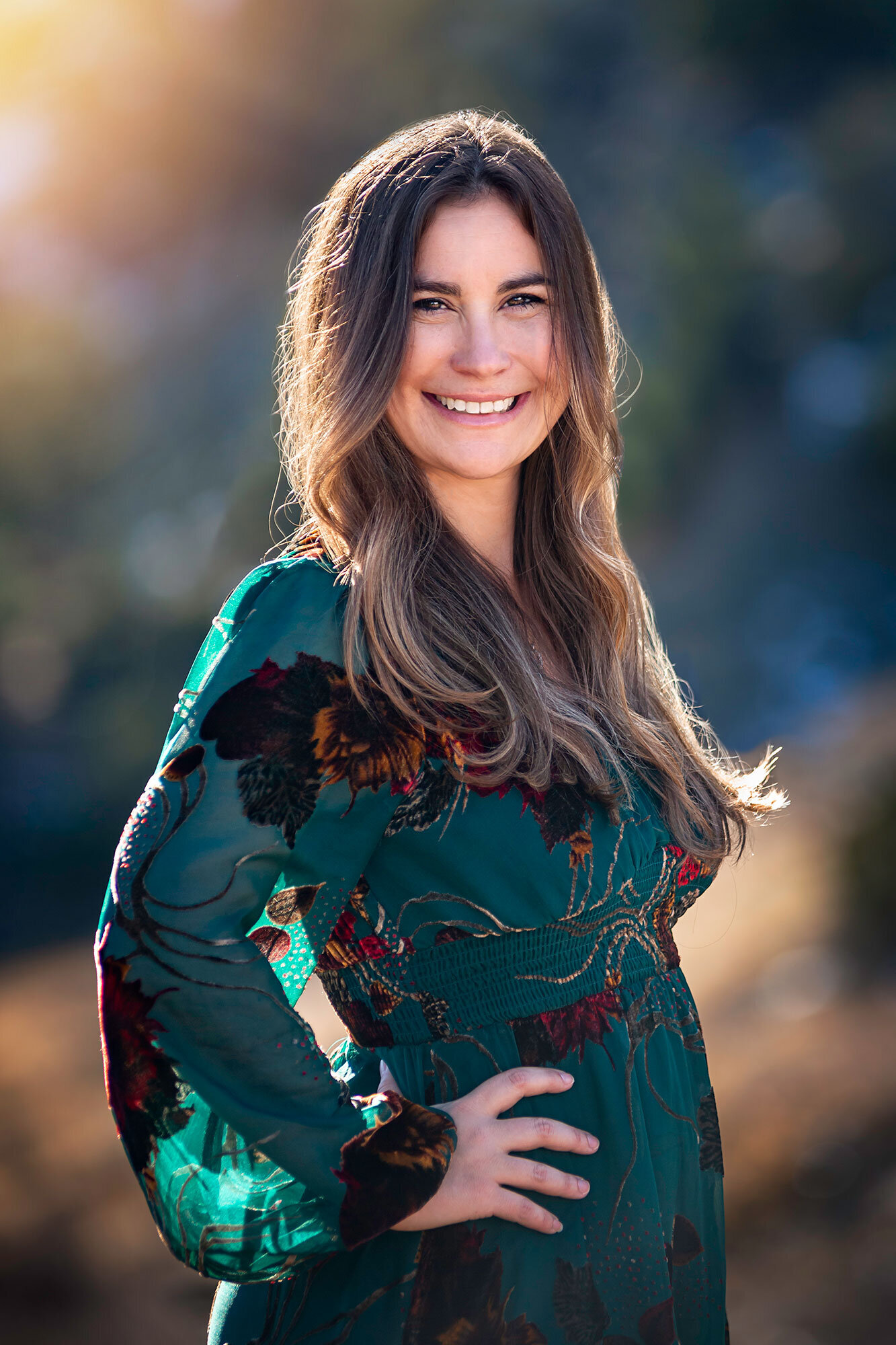 outdoor-headshot-professional-light-colorful-chef-cater-colorado-mountain-woman-elegant-emerald-dress