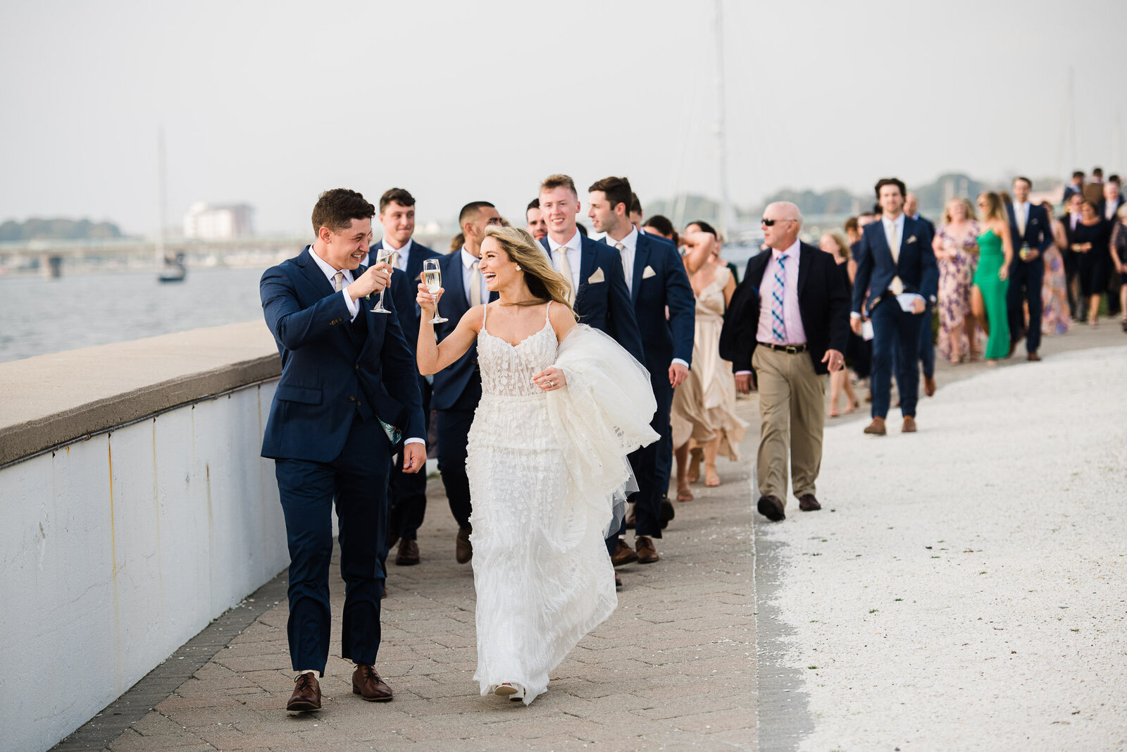 couple walking to cocktail hour with guests
