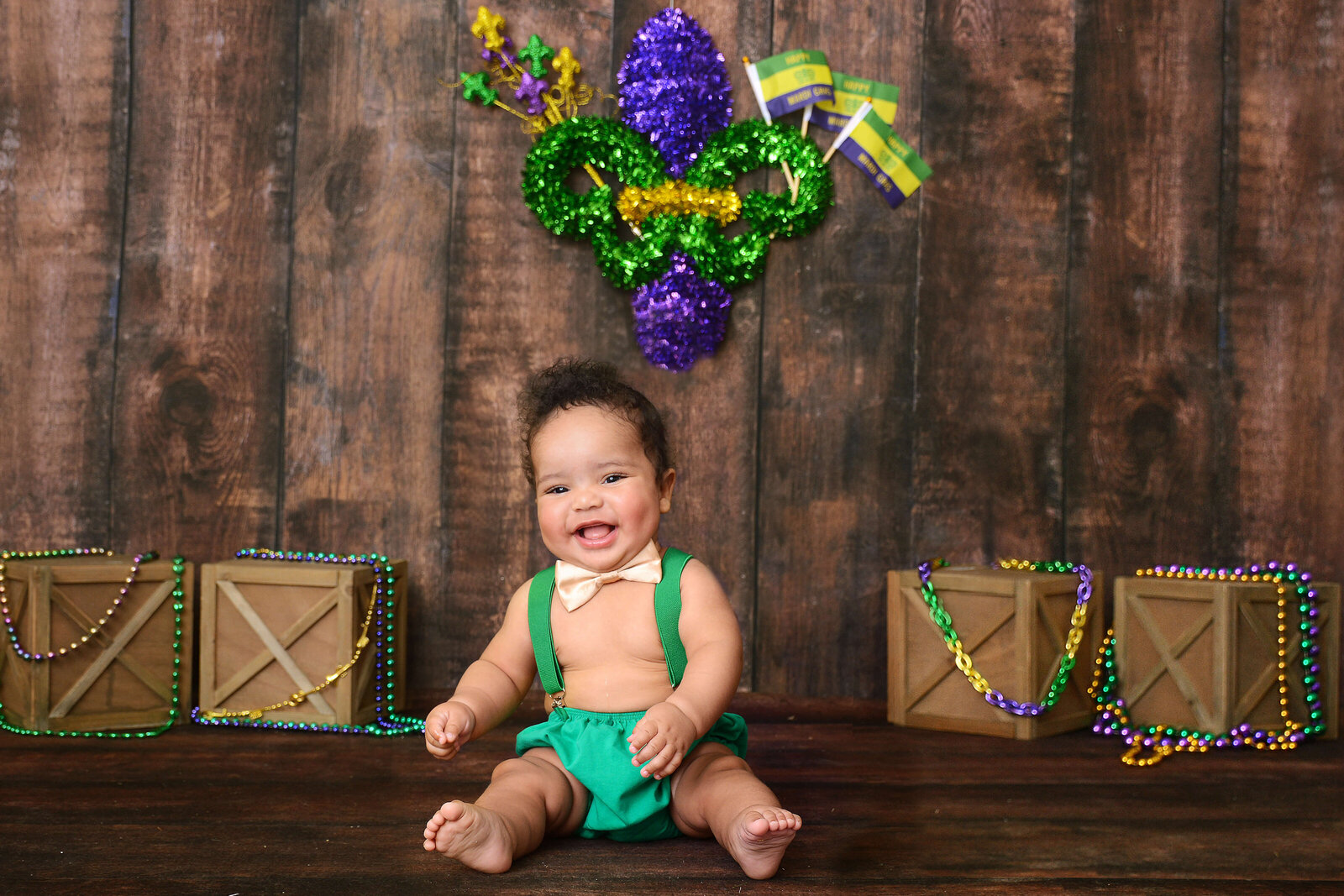 boy smiles at a photo studio in houston