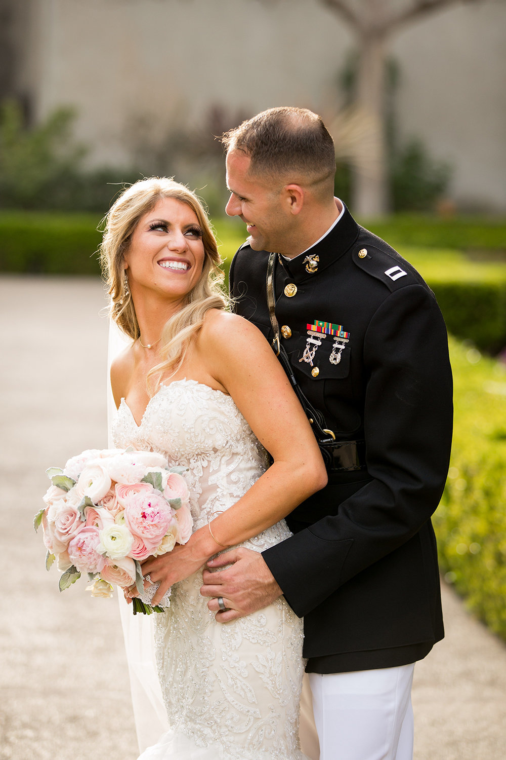 bride in groom in balboa park for their prado wedding