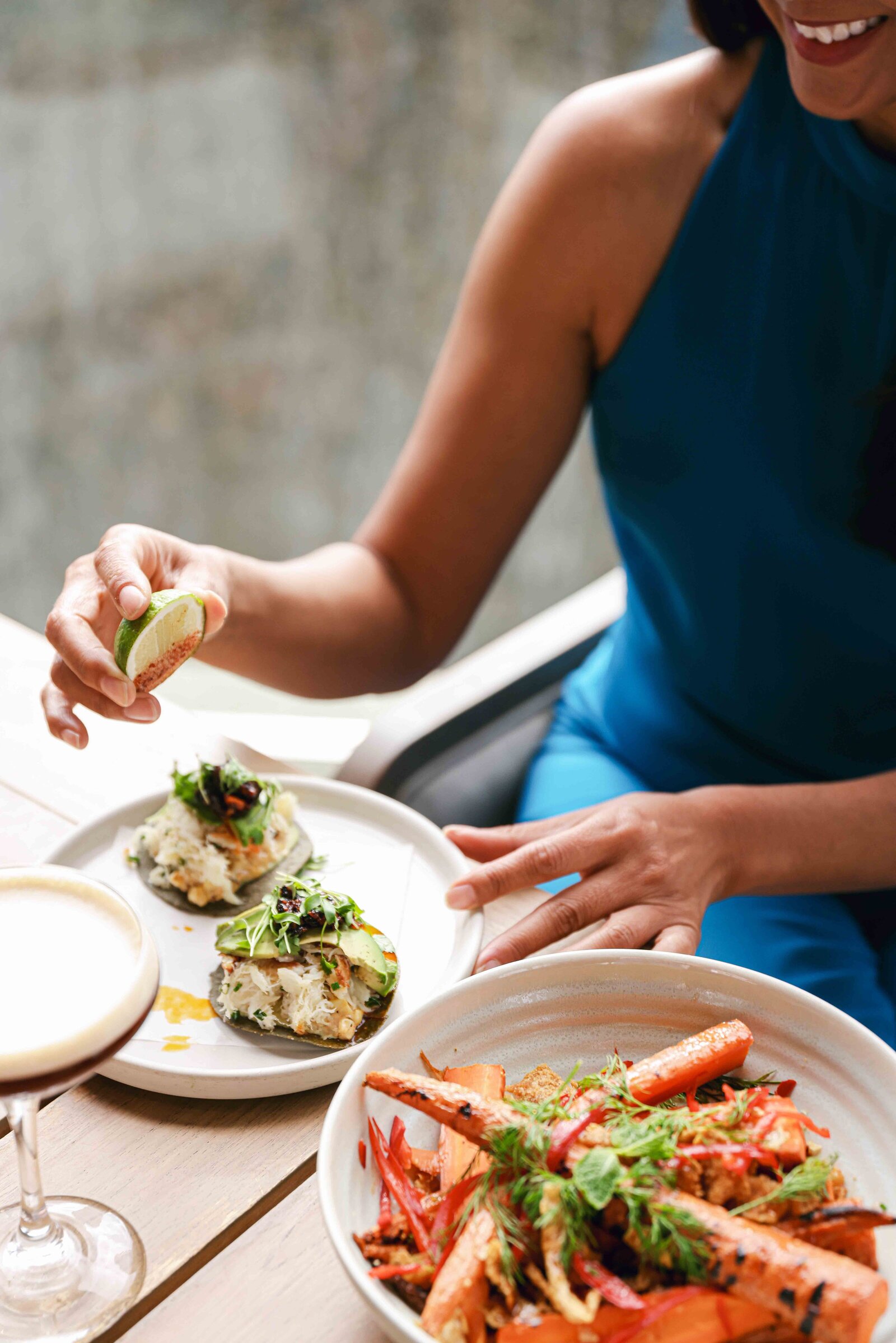 Food and espresso martini at boutique hotel with chic patron dining. Corporate event photography lifestyle experience elevated.