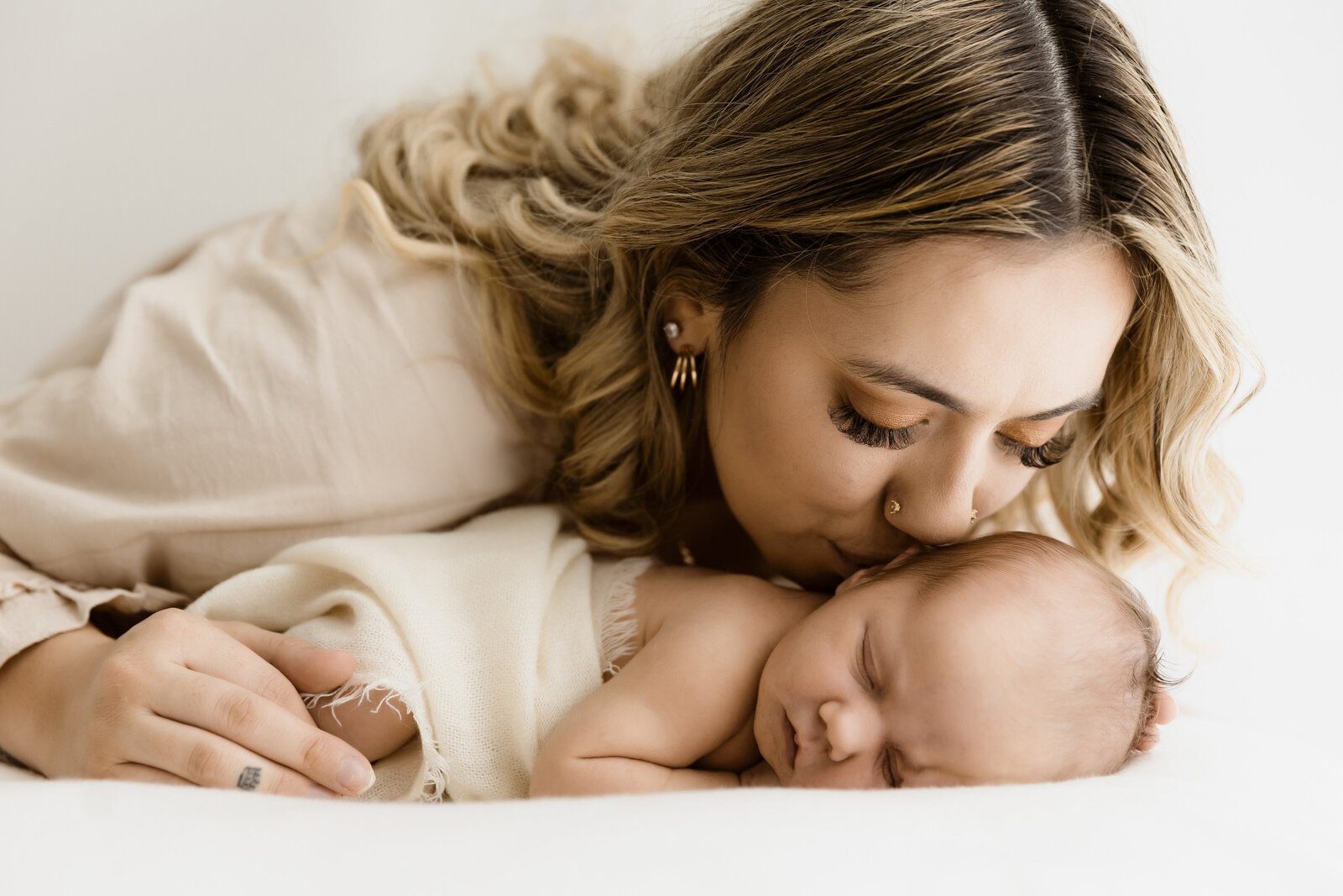 kisses for newborn baby from mother in Brisbane family Phtooshoot