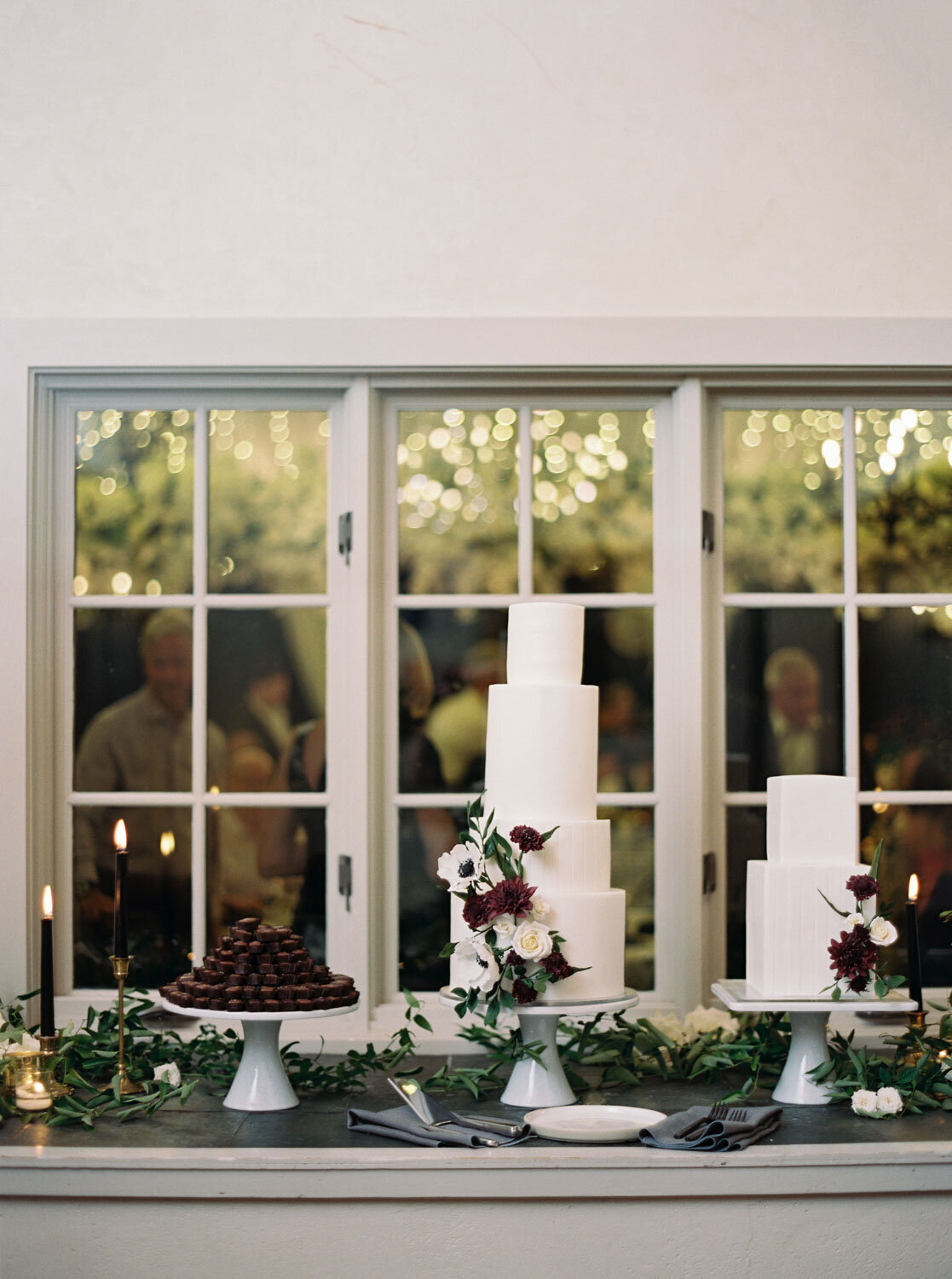 White wedding cake display near a window