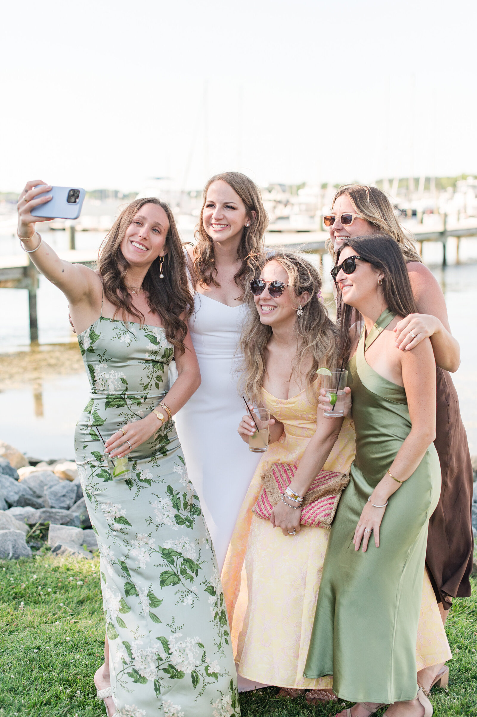 bride and friends taking selfie on wedding day