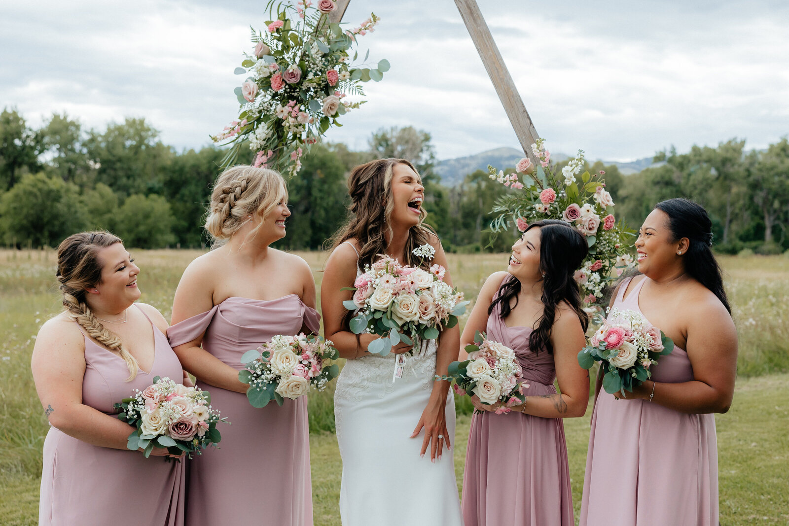 Denver Wedding Photographer captures bride laughing with bridesmaids
