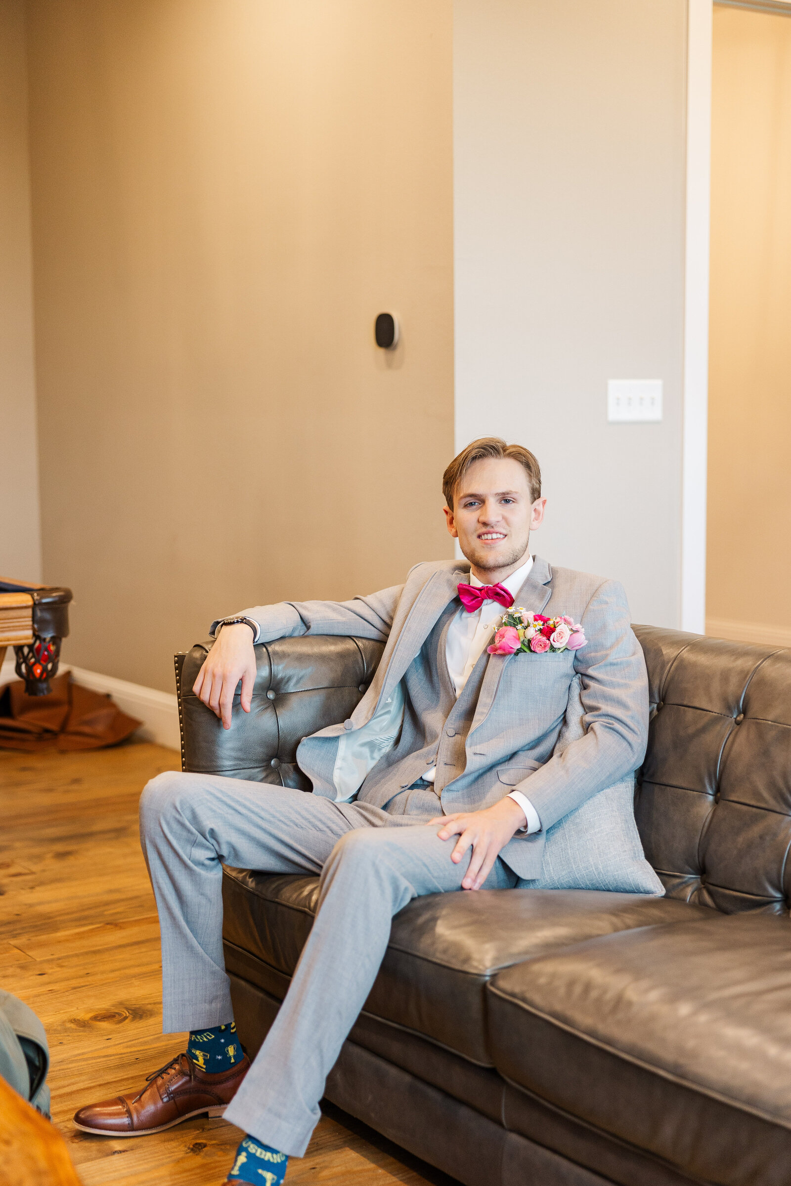 Groom-sitting-on-sofa-portrait