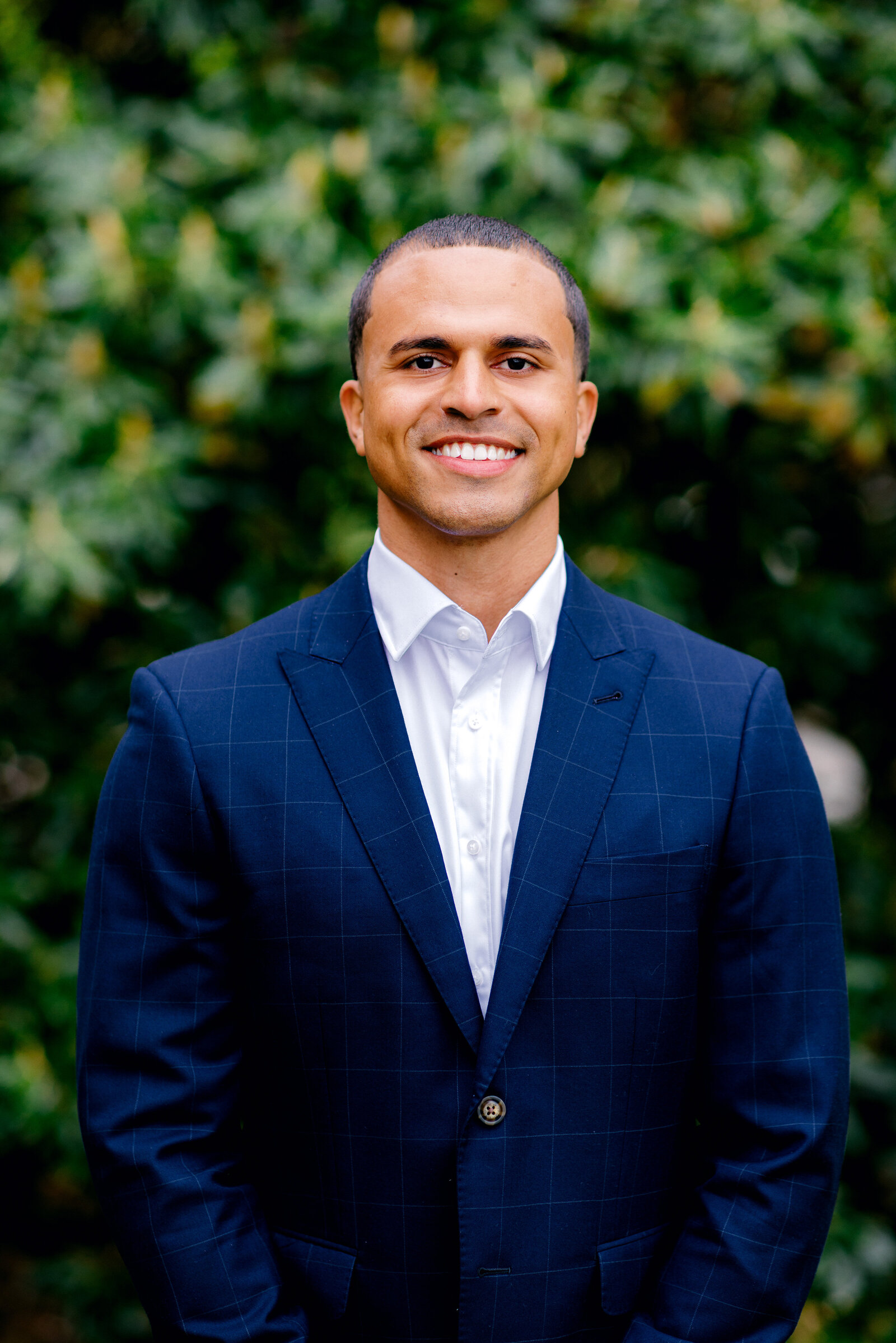 Man smiling in suit for professional headshot