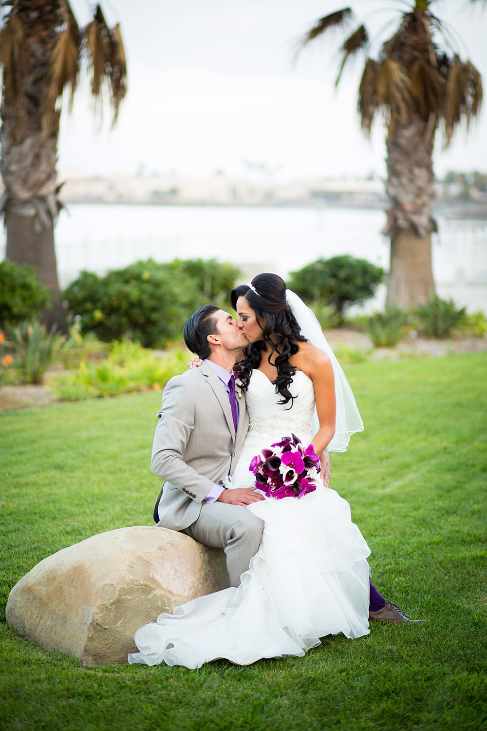 bride and groom kissing at coronado community center