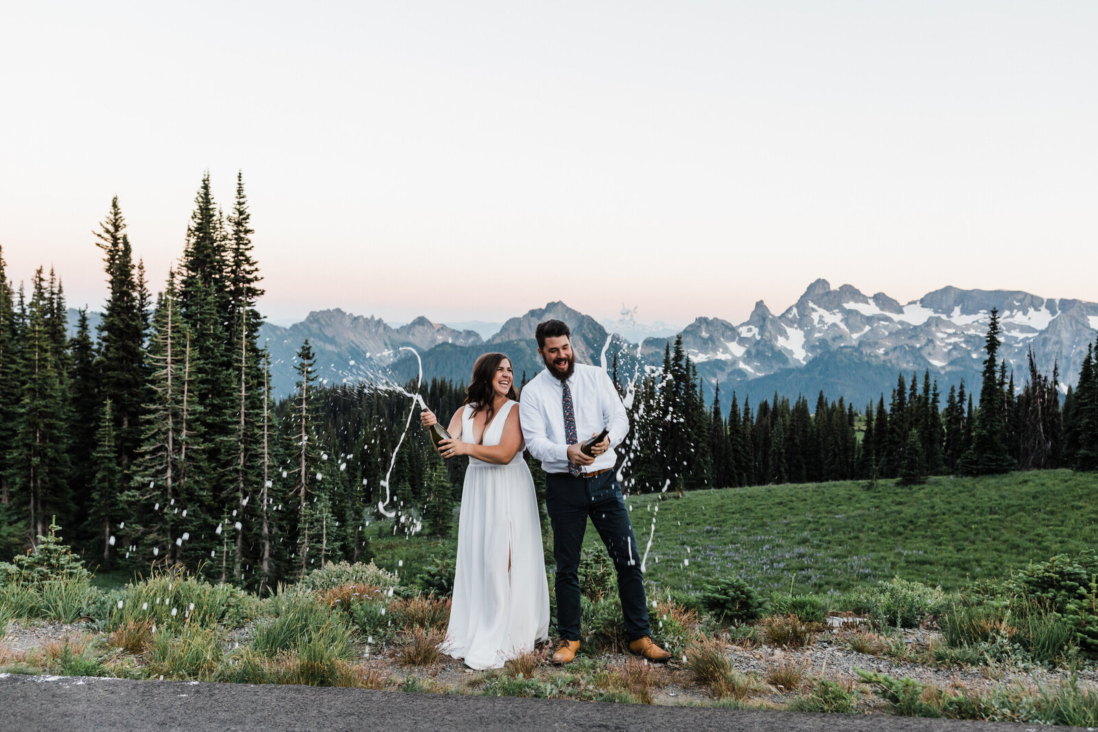 A LGBTQ+ couple enjoys cake on their wedding day at their PNW elopement.