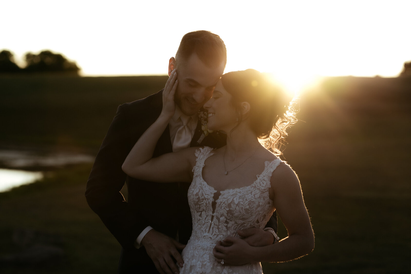 A bride and groom enjoy golden hour during a wedding reception at White Barn.