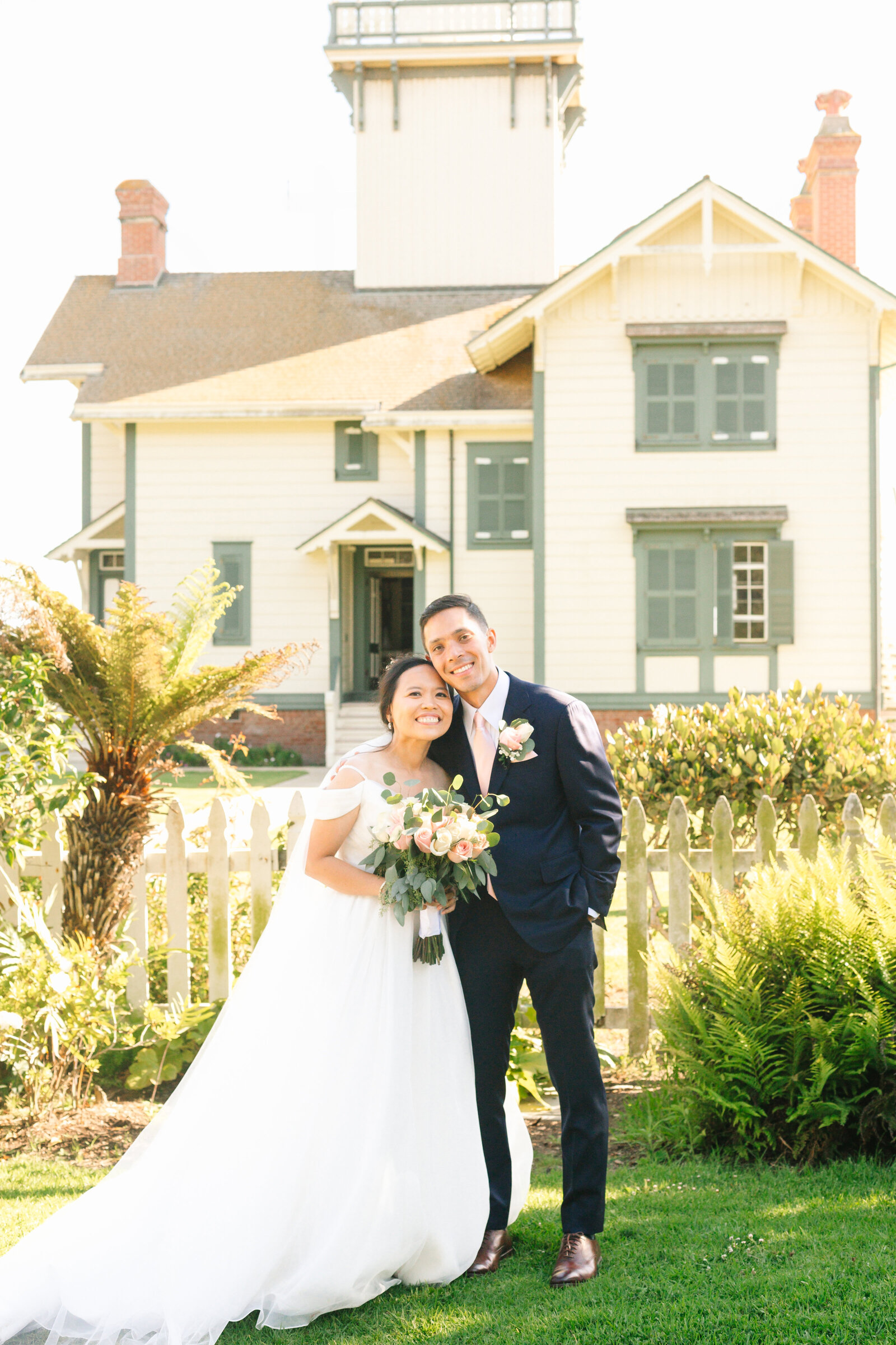 A newlywed couple holds hands after their wedding ceremony in San Pedro, Ca.