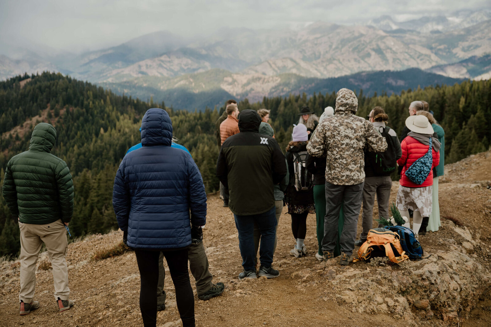 Family and friends watching mountain top ceremony