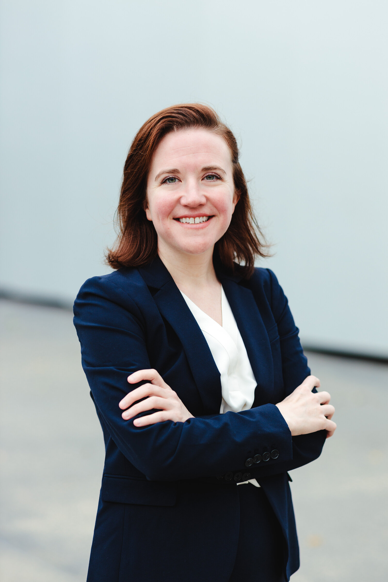 Woman crossing arms and smiling for professional photos