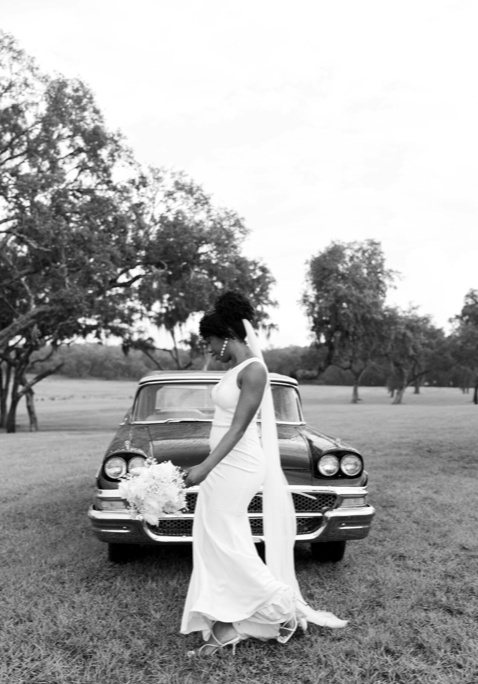 Bride with vintage car