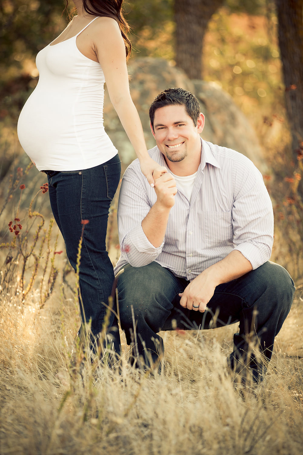 Adorable father with expecting mother during San Diego Maternity Session.