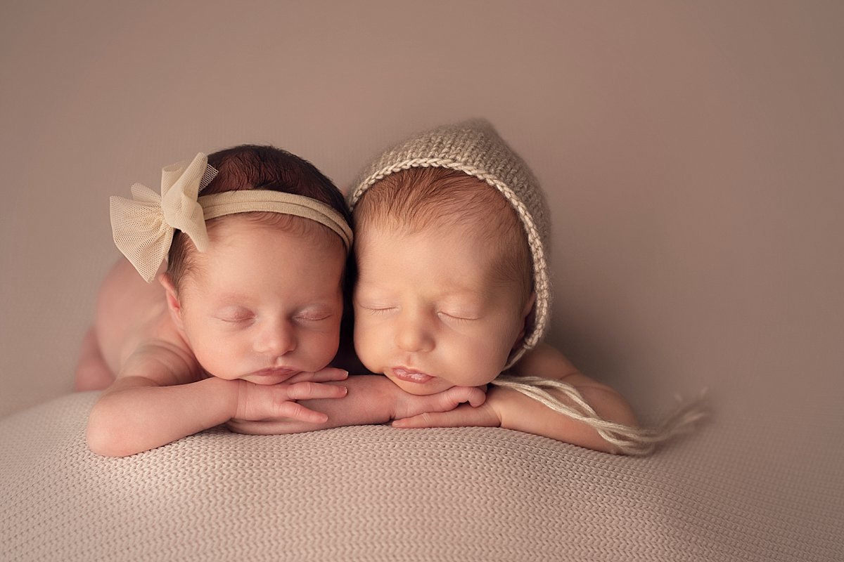 twin-newborn-head-on-hands-decatur