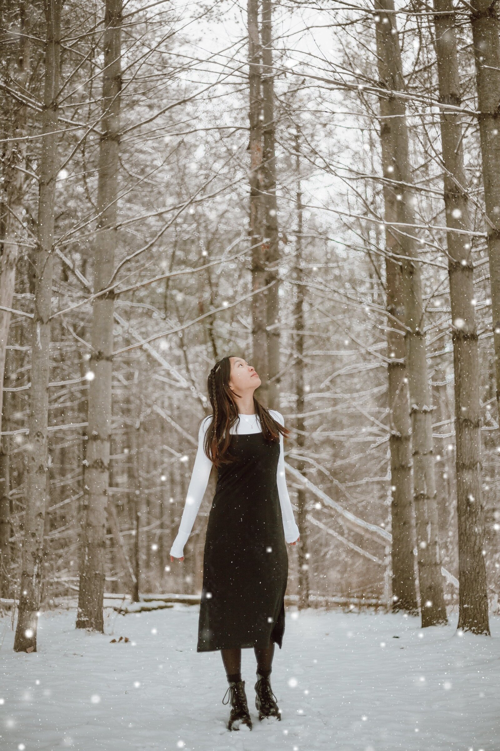 woman in black dress in snow