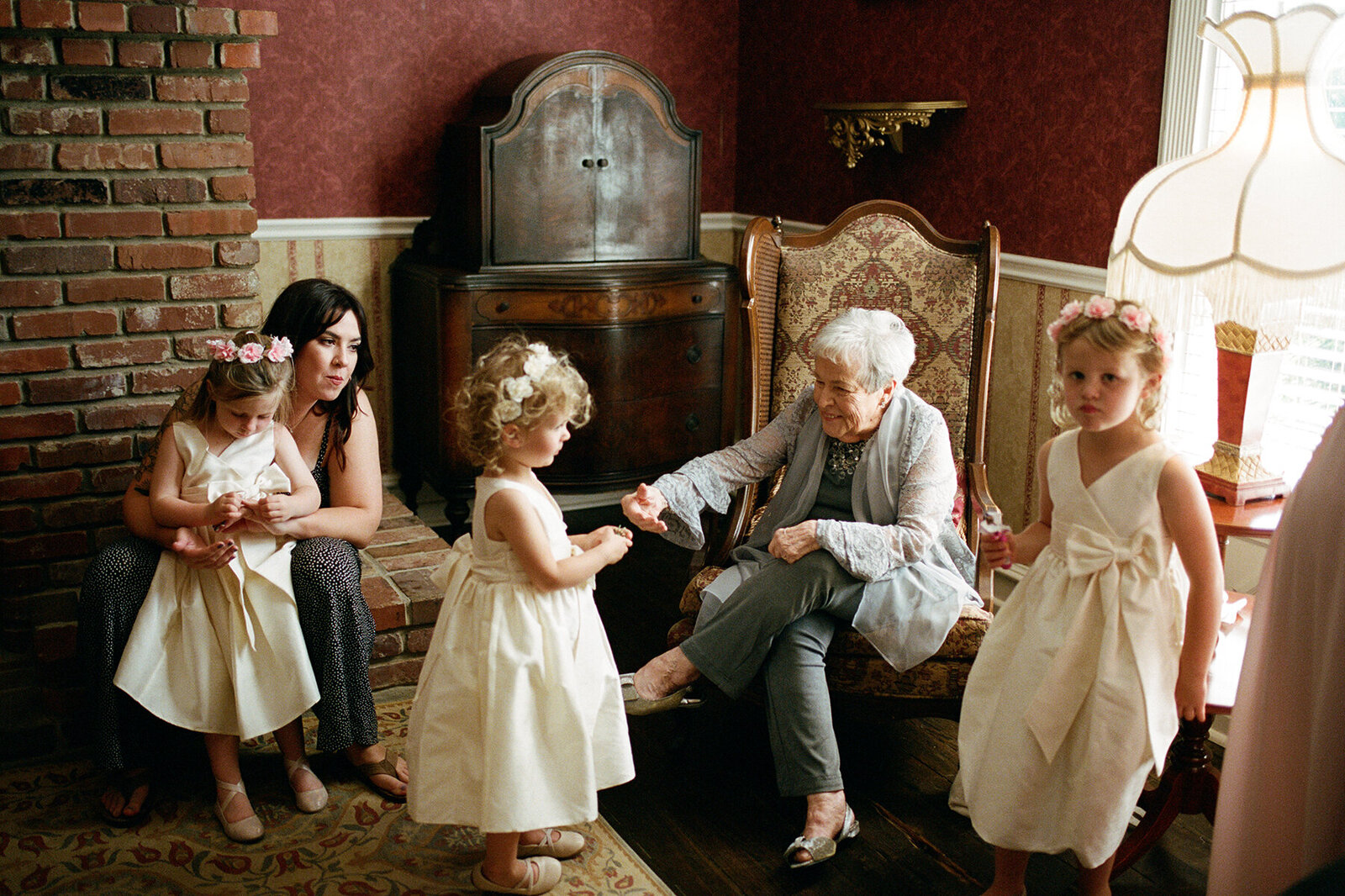 Grandma with the flower girls on film before a wedding at Legacy Farms