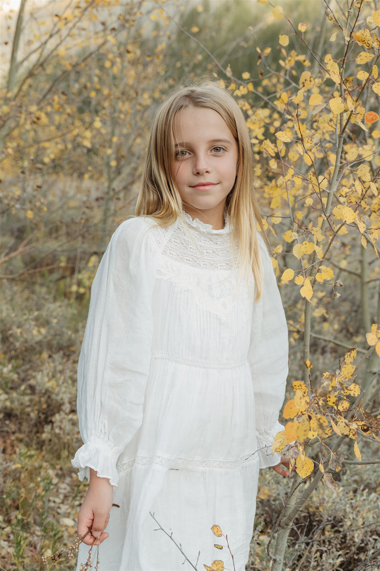 Luxury Aspen family photography — the Stanley family styled in Ralph Lauren–inspired layers with the Rocky Mountains in the background.