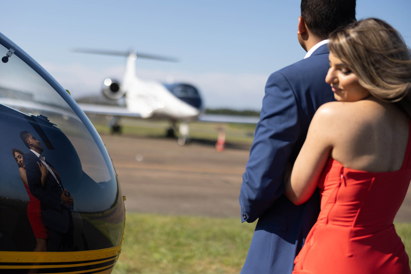 reflection-of-engaged-indian-couple-with-helicopter