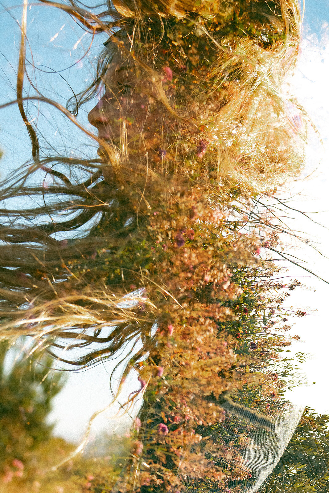 double exposure of girl with long hair and florals