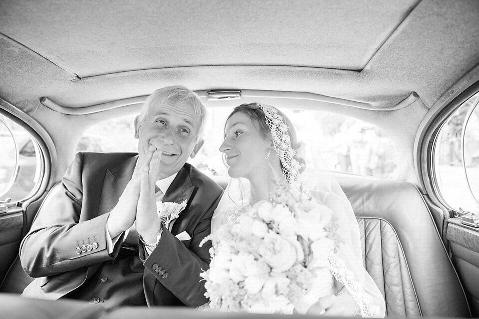 father-of-the-bride-in-car-with-bride