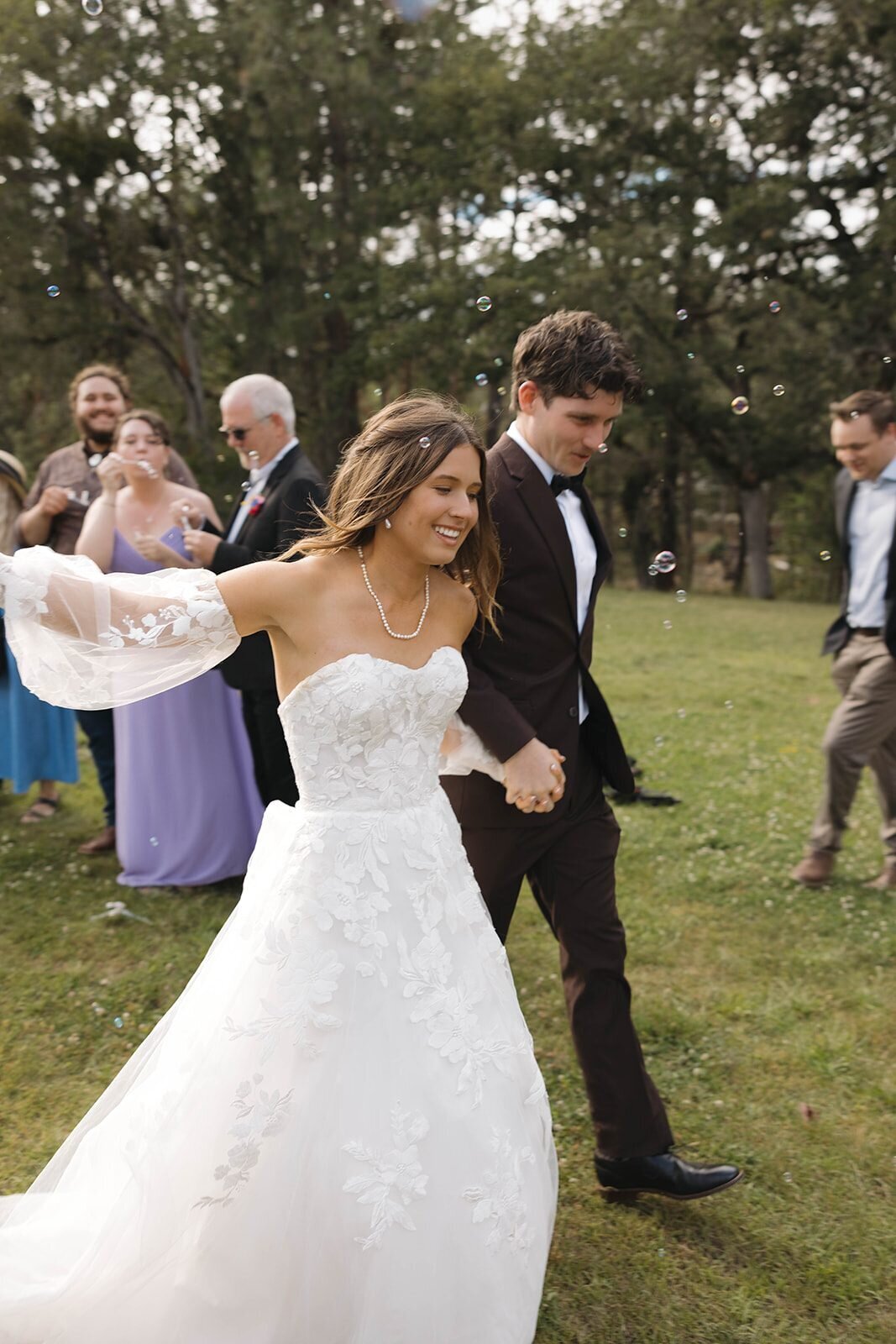 Bride and groom laughing during their bubble exit