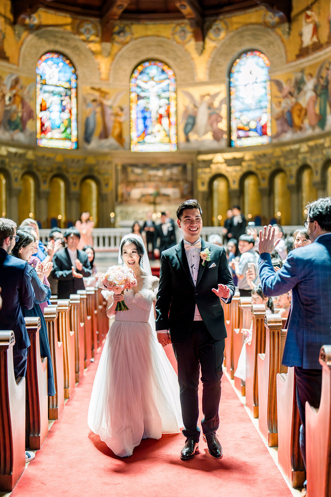 A captivating wedding ceremony held at the iconic Stanford Memorial Church, featuring stunning stained-glass windows and grand architecture.