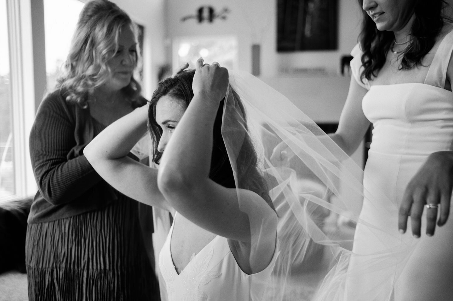 Bride gets her veil on.