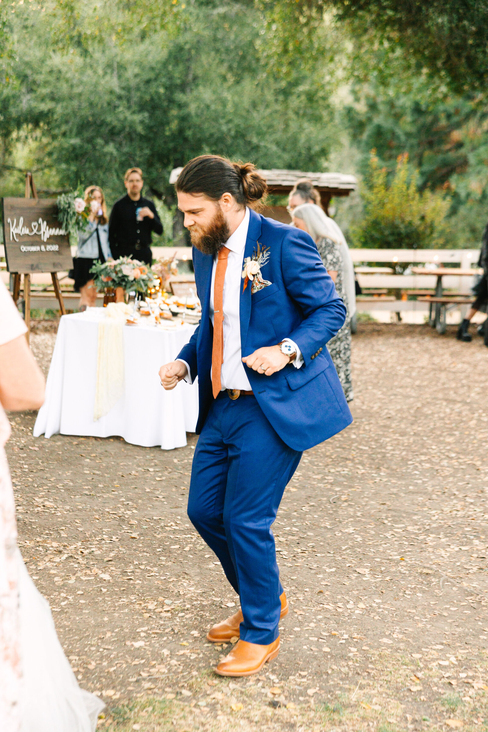 Tattoo bride and groom at their colorful wedding reception in Santa Cruz, California.