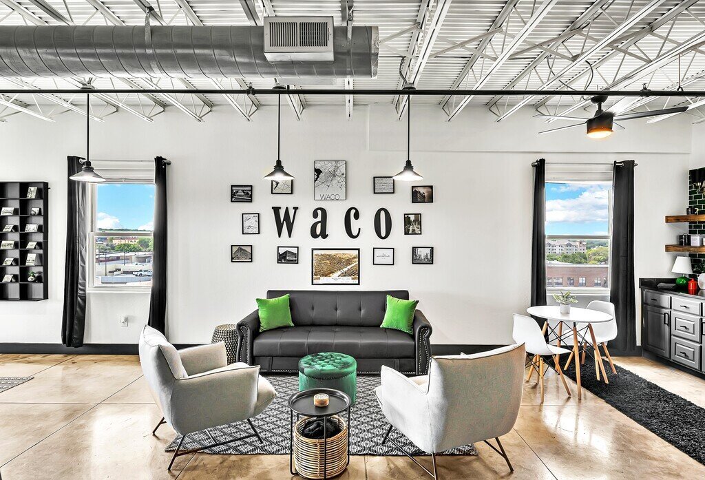 A nod to old Waco in the living room of this one-bedroom, one-bathroom vacation rental condo with sleeping space for four is walking distance from the Silos, McLane Stadium, and Baylor University in downtown Waco, TX