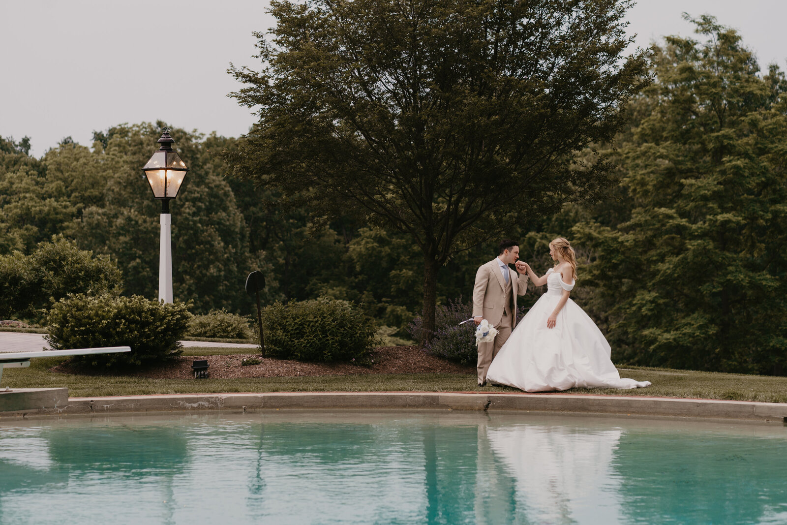 Bride and groom holding hands at their wedding reception