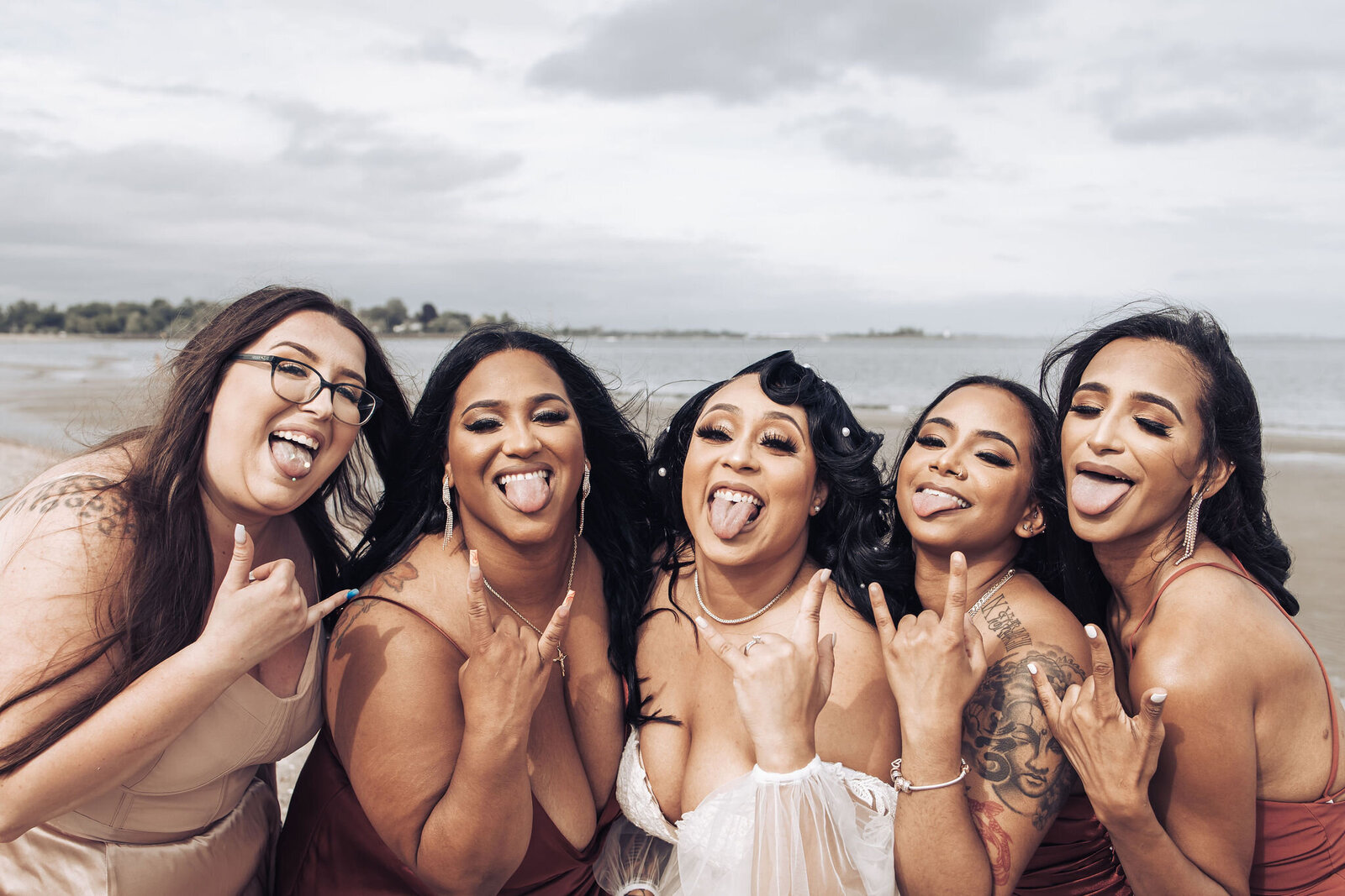 bride taking a silly photo with bridesmaids