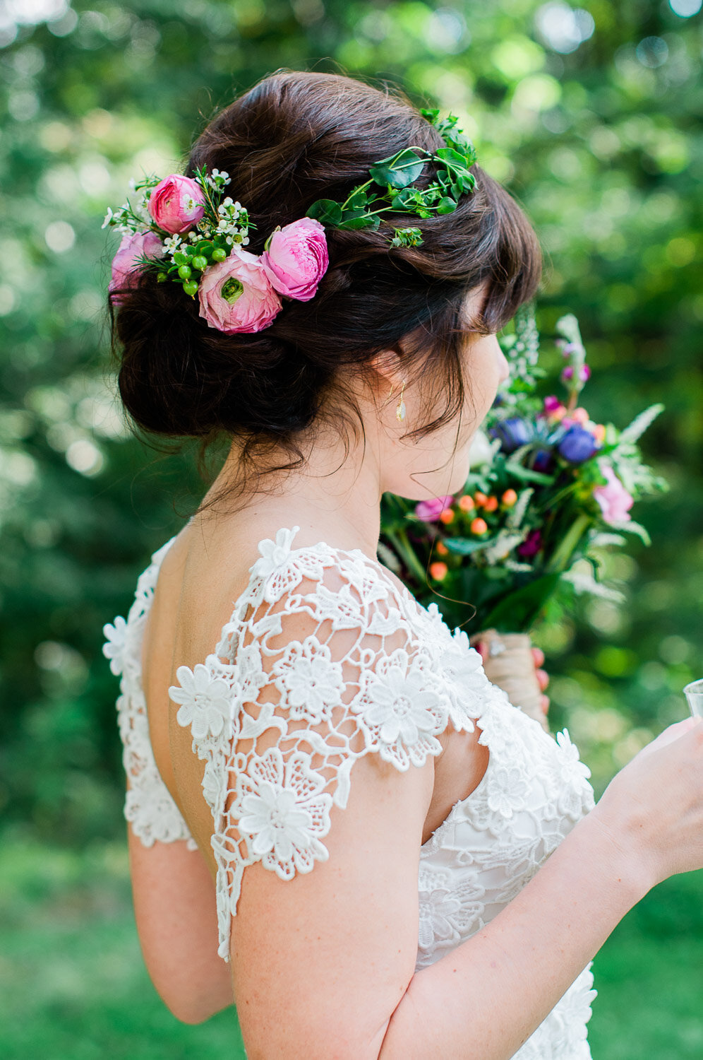 bride from behind closeup of hair florals and shoulder details