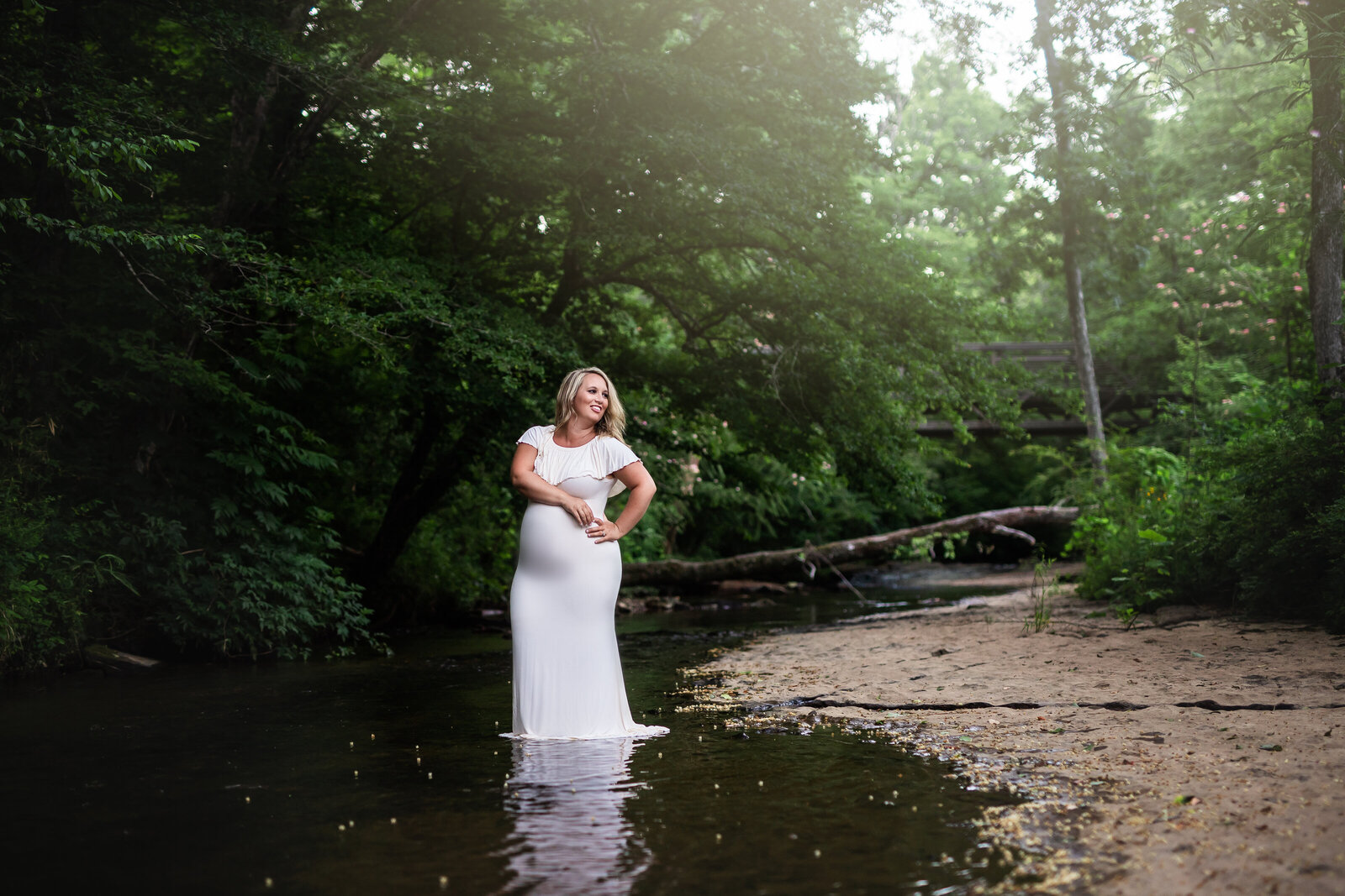 Beautiful mother during her maternity session by a creek located  near Birmingham