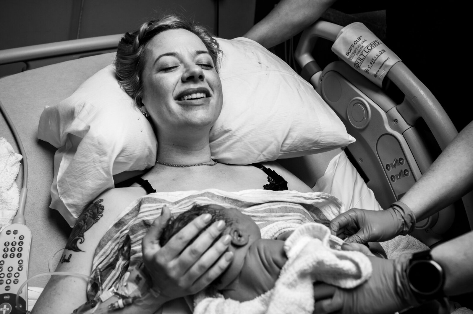 mom smiles after hospital birth