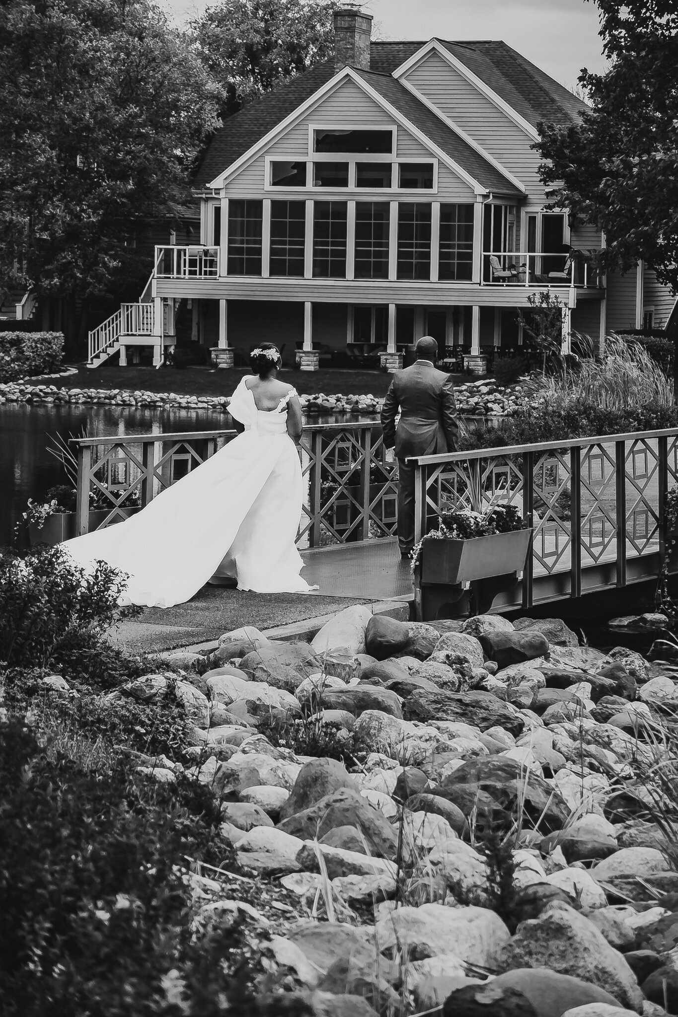 bride and groom taking first look photo in country club